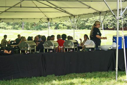 The experienced staff at Simply Fresh Events will help you stage your best company picnic ever - like this one in the shade of a large tent in June 2015.