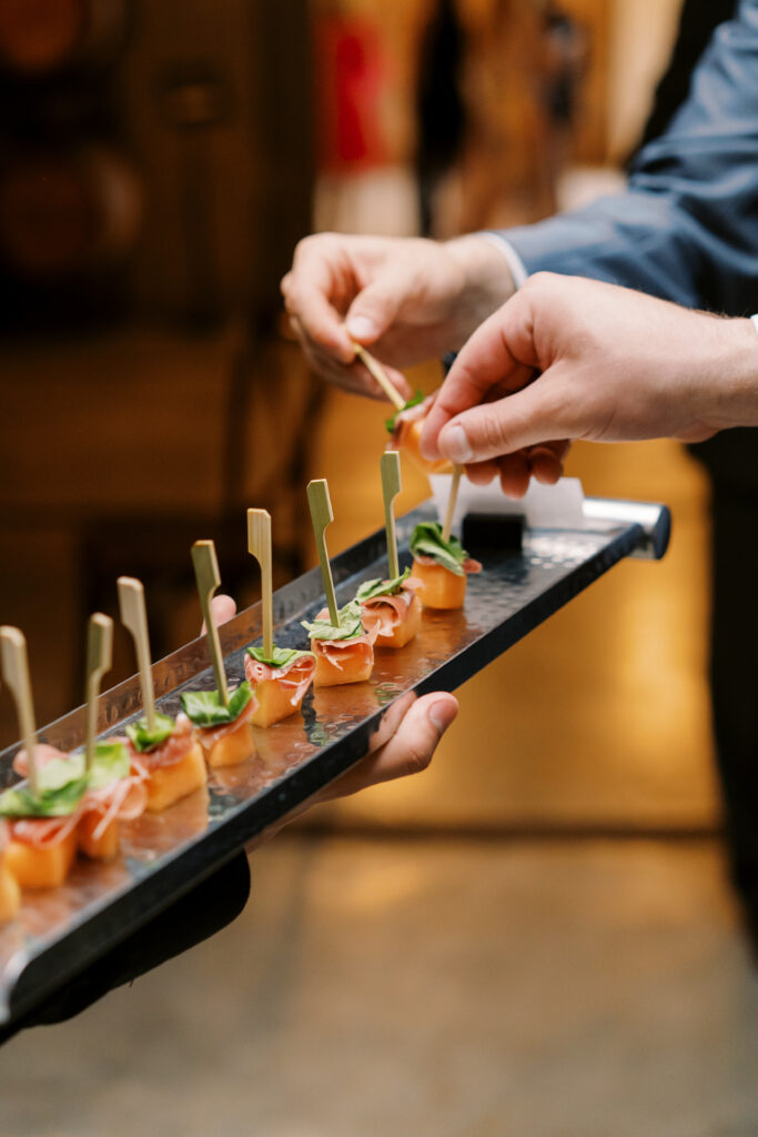 Passed appetizer tray of melon and prosciutto 