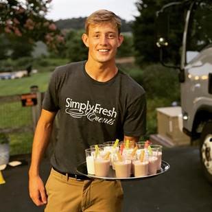 A person carrying a tray of milkshakes

Micro-wedding

Intimate wedding reception